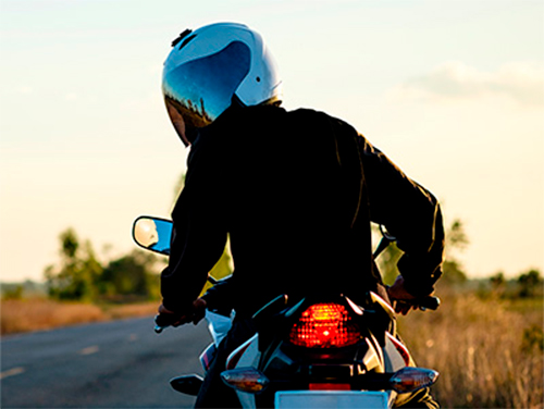 Motorcyclist looking back. Intro for motorcycle course.